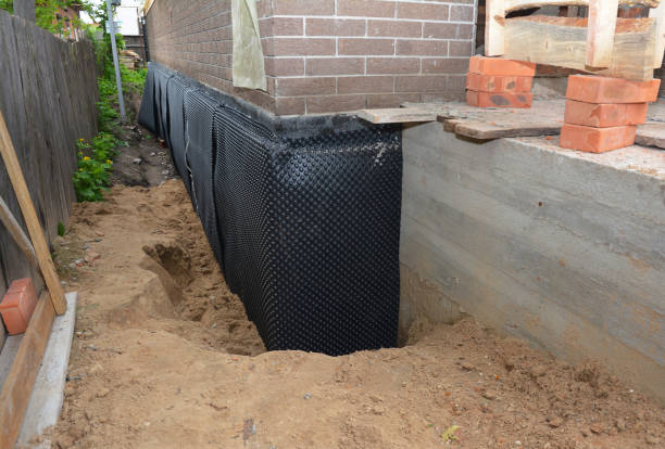 Happy homeowners after waterproofing job in Coldwater